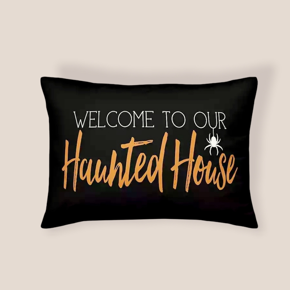 Welcome to Our Haunted House Pillow. Orange Black